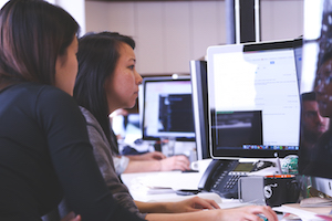 Two women pair programming